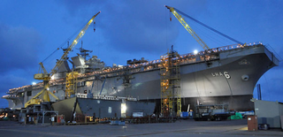 Illustration for article titled USS America: The Navy's Newest Flattop Can't Decide What The Hell It Is